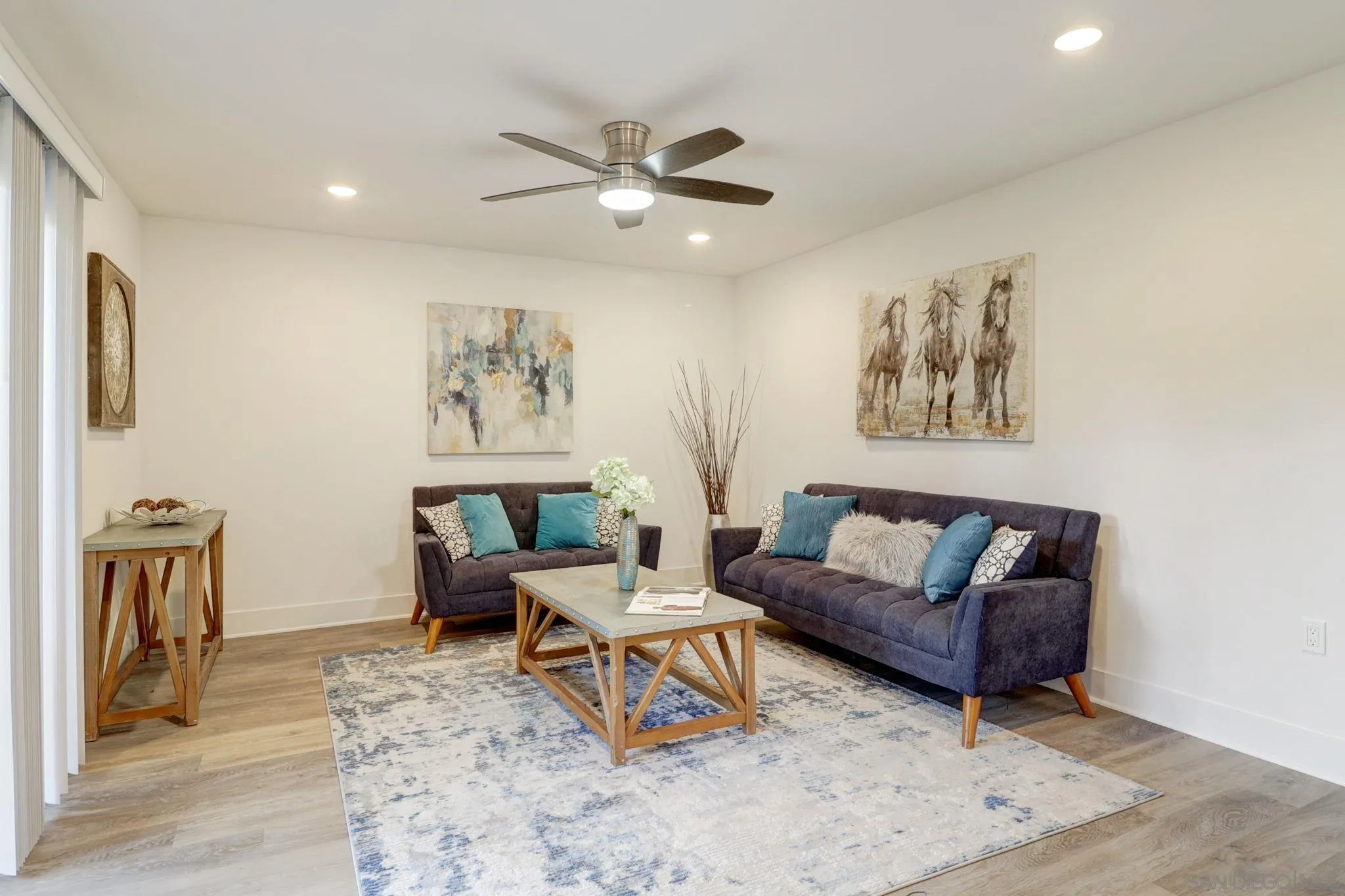 8660 Via Mallorca, Unit B La Jolla, CA 92037 - Photo 4 of 27 a living room with furniture and a rug