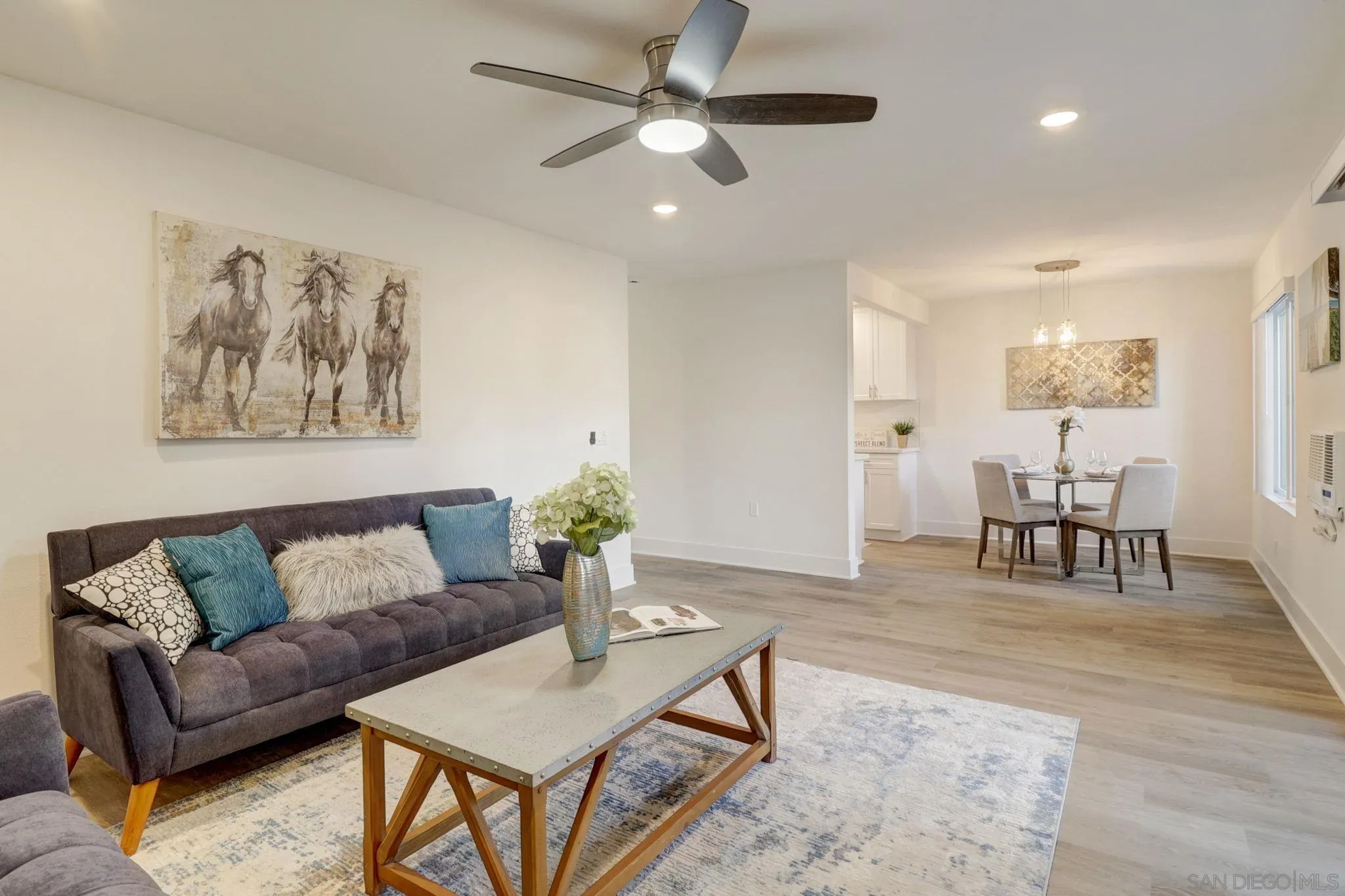 8660 Via Mallorca, Unit B La Jolla, CA 92037 - Photo 5 of 27 a living room with furniture and wooden floor
