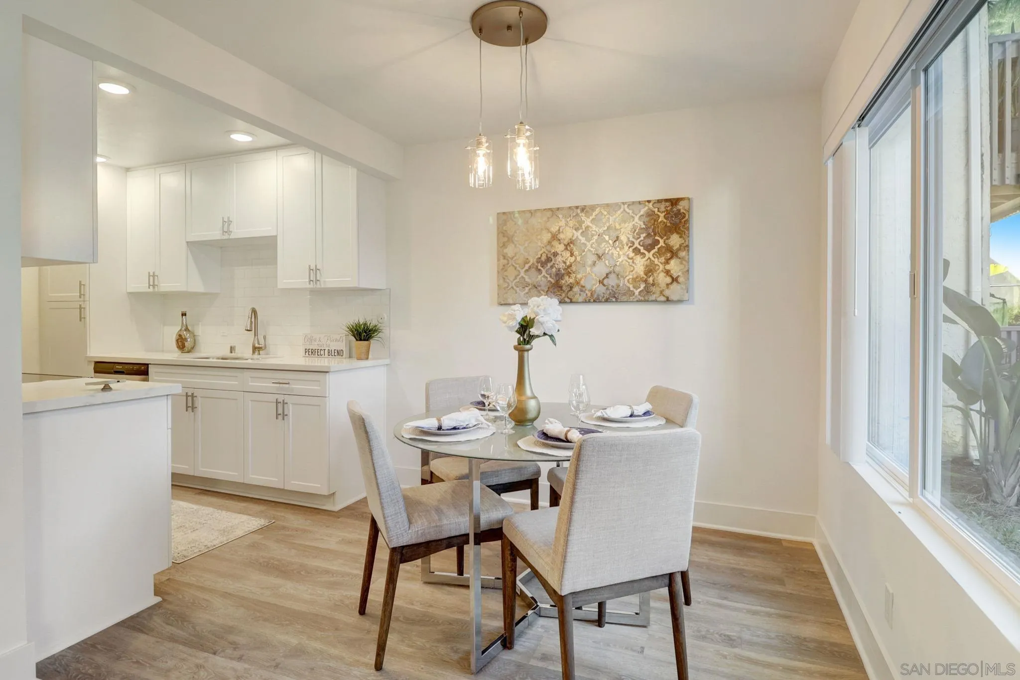 8660 Via Mallorca, Unit B La Jolla, CA 92037 - Photo 6 of 27 a view of kitchen with cabinets and wooden floor