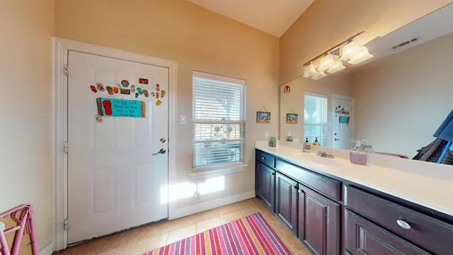 a kitchen with sink cabinets and window