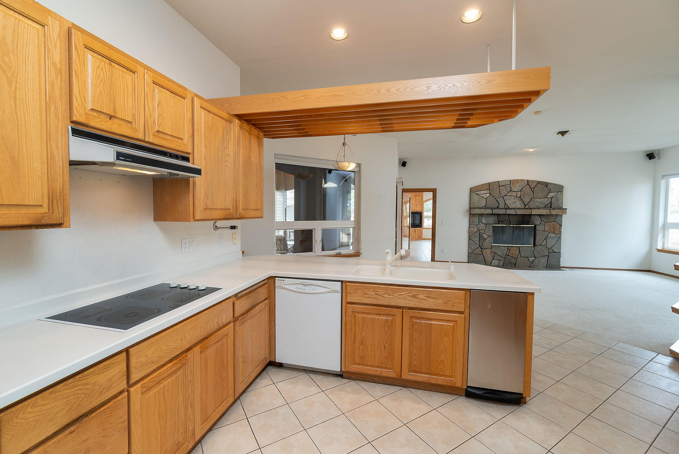 60895 Jennings Road Bend, OR 97702 - Photo 10 of 47 a kitchen with stainless steel appliances granite countertop a sink and cabinets