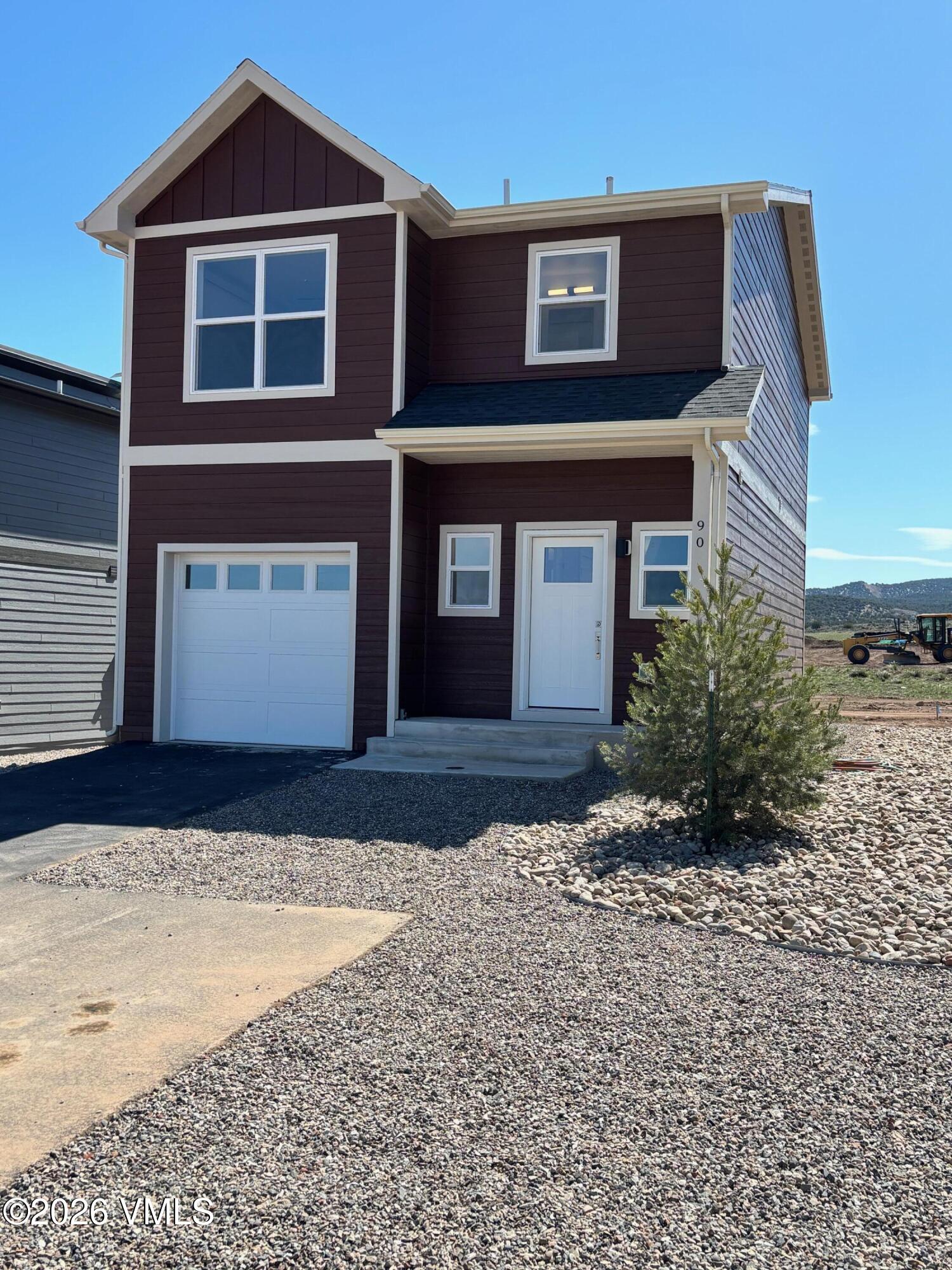90 Comanche Way Gypsum, CO 81637 - Photo 2 of 46 a front view of a house with a yard