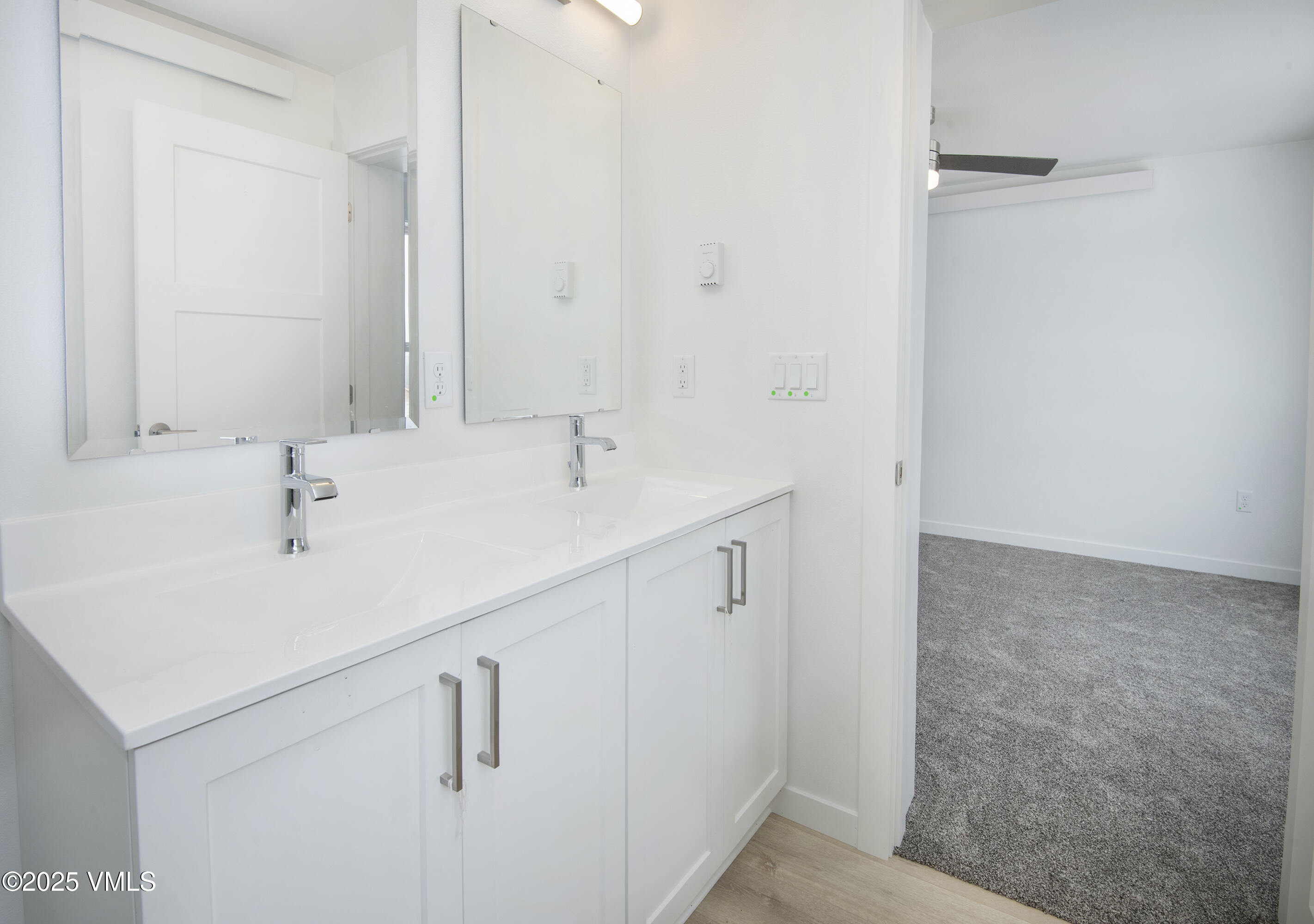 90 Comanche Way Gypsum, CO 81637 - Photo 25 of 46 a bathroom with a sink and a mirror