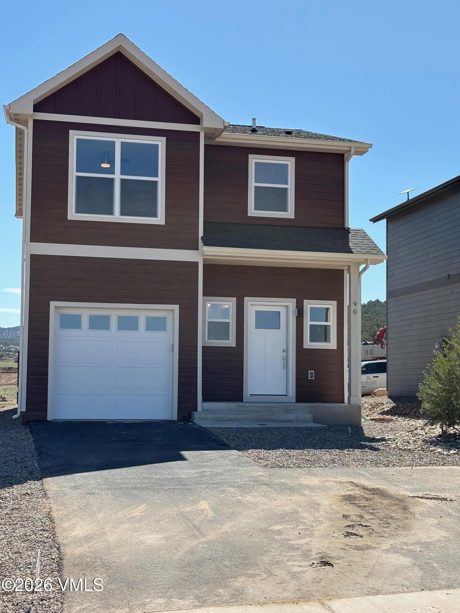 90 Comanche Way Gypsum, CO 81637 - Photo 5 of 46 a front view of a house with a yard
