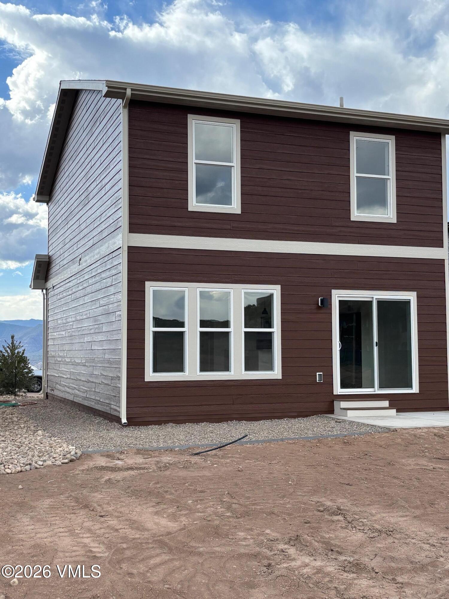 90 Comanche Way Gypsum, CO 81637 - Photo 6 of 46 a front view of a house with a garden