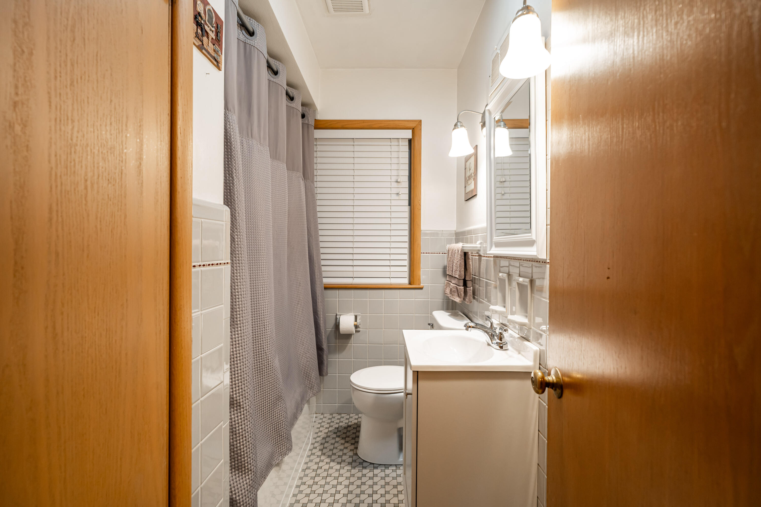 2777 South 68th Street Milwaukee, WI 53219 - Photo 12 of 16 Mosaic tile, new vanity, tiled tub/shower