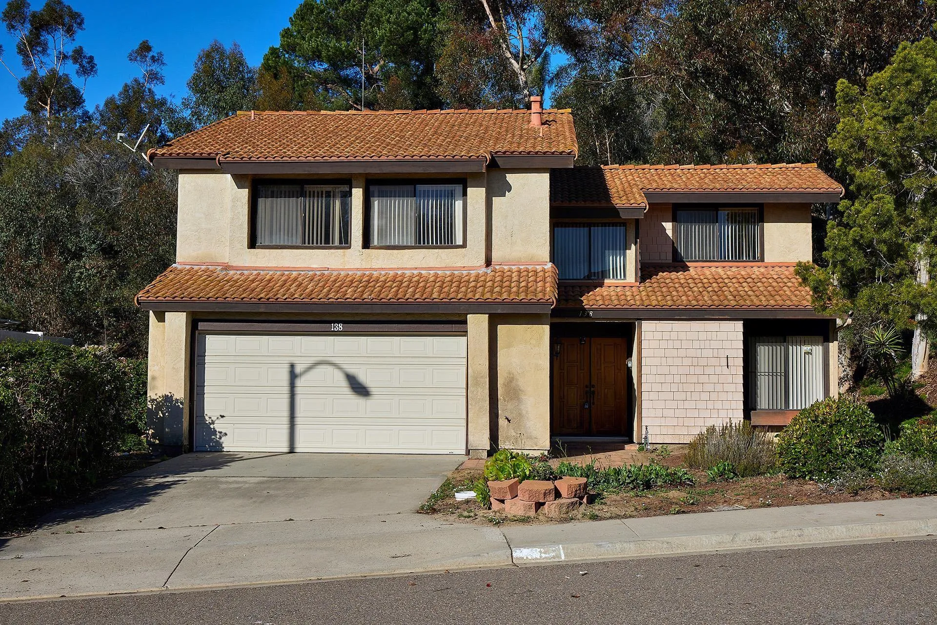 138 Townwood Way Encinitas, CA 92024 - Photo 1 of 48 a front view of a house with a garden