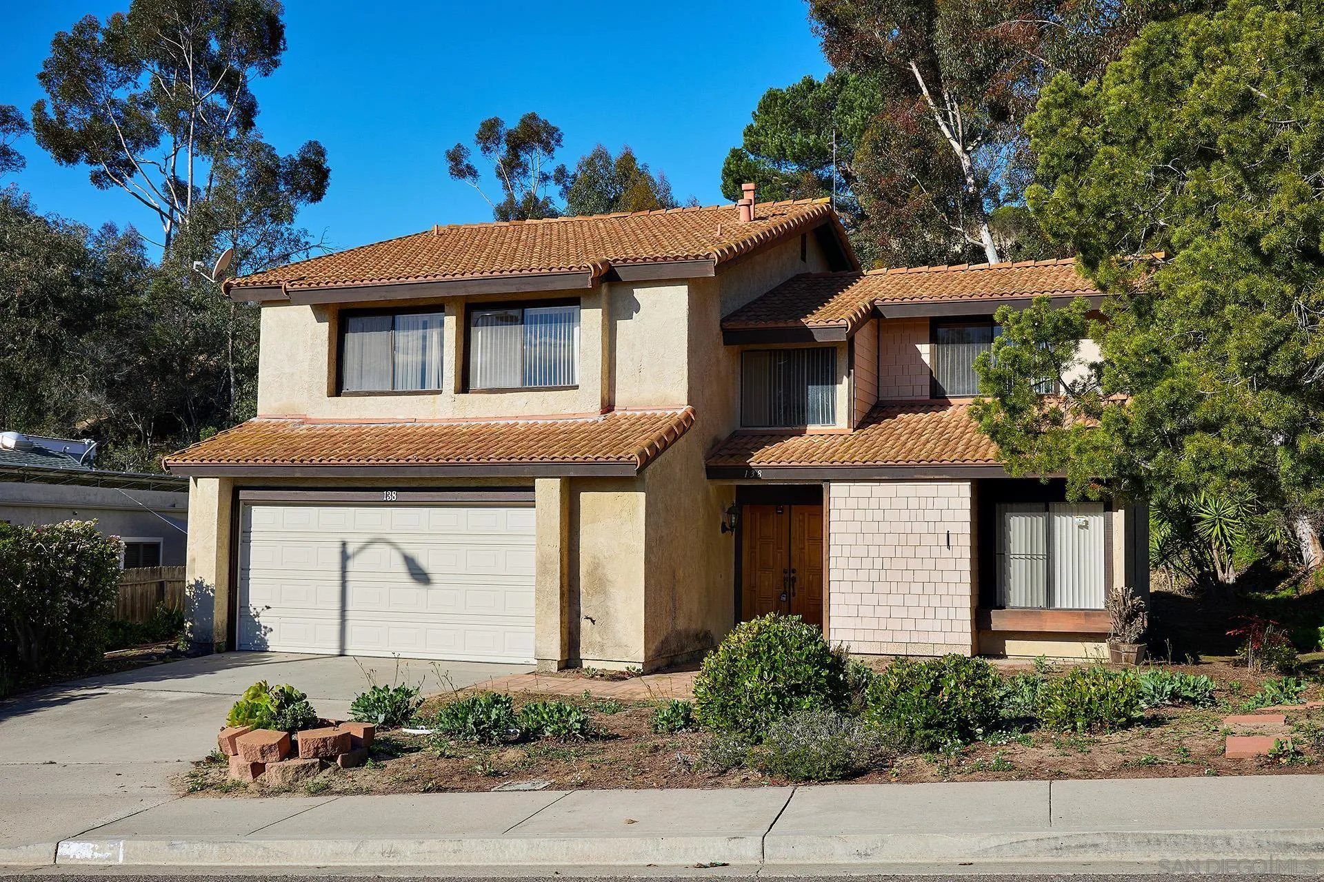 138 Townwood Way Encinitas, CA 92024 - Photo 2 of 48 a front view of a house with a yard and garage