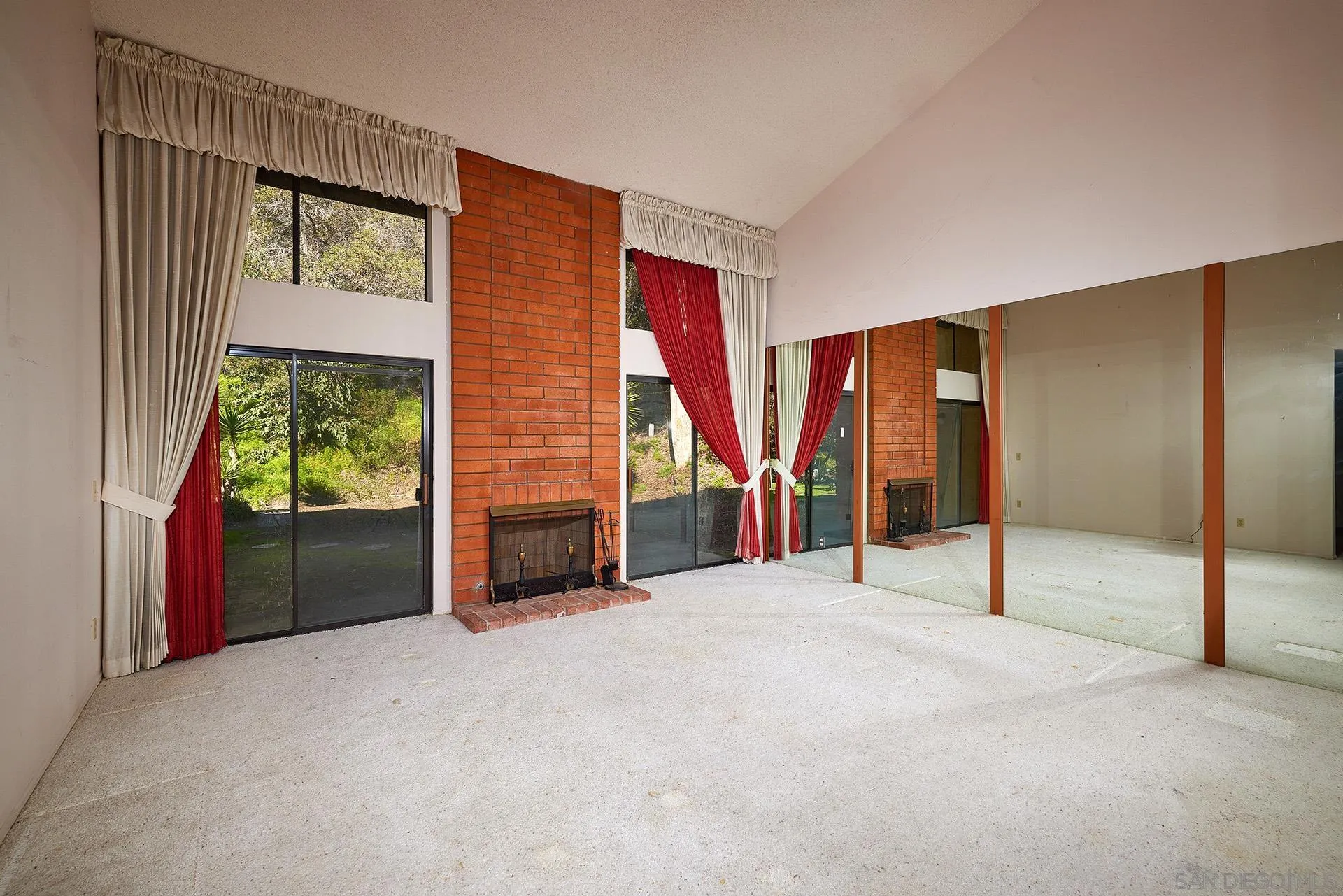 138 Townwood Way Encinitas, CA 92024 - Photo 3 of 48 a view of an empty room with a fireplace and windows