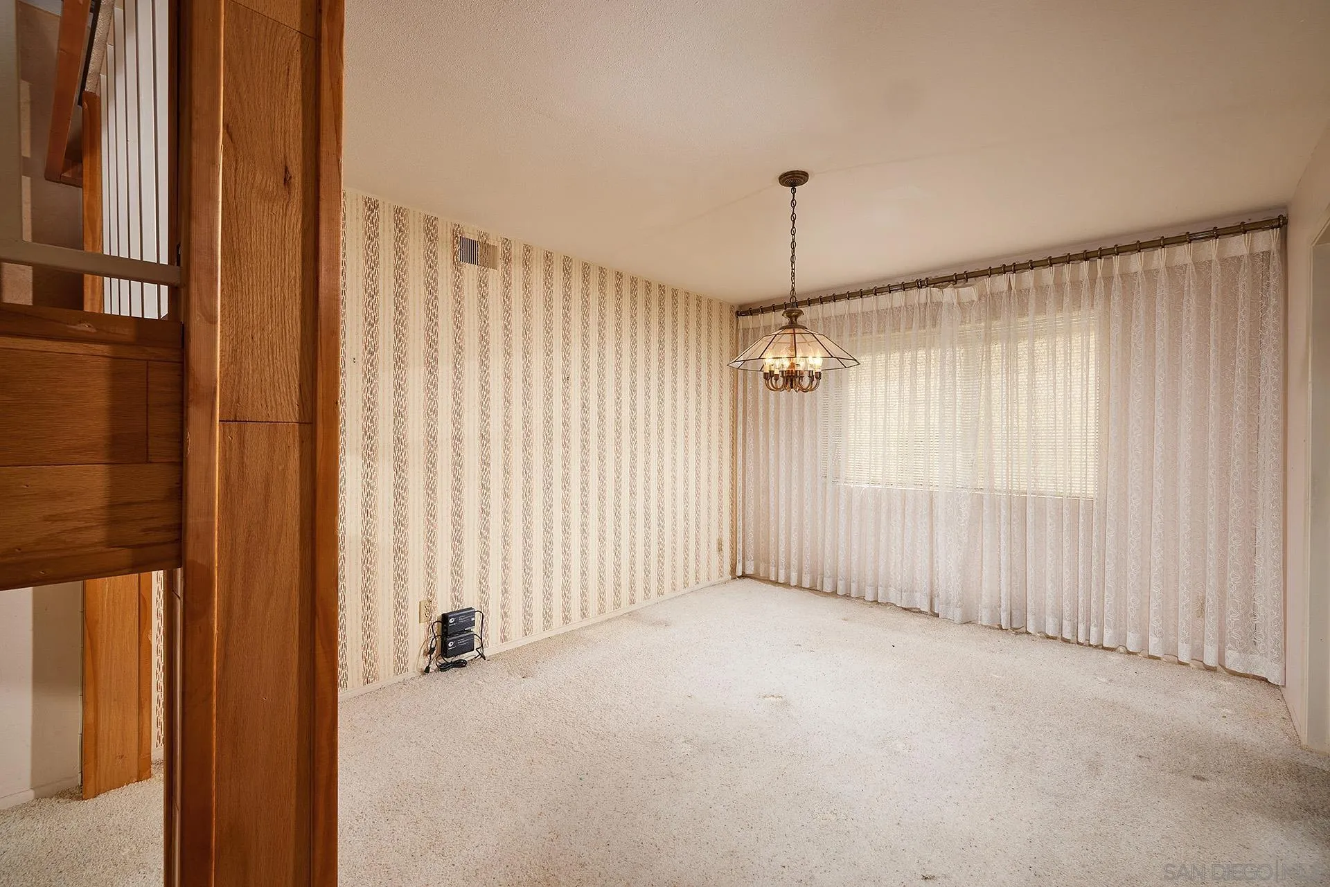 138 Townwood Way Encinitas, CA 92024 - Photo 8 of 48 a view of a livingroom with a chandelier fan and windows