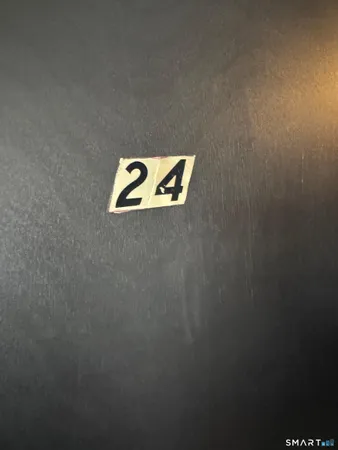 a view of a storage & utility room with a window