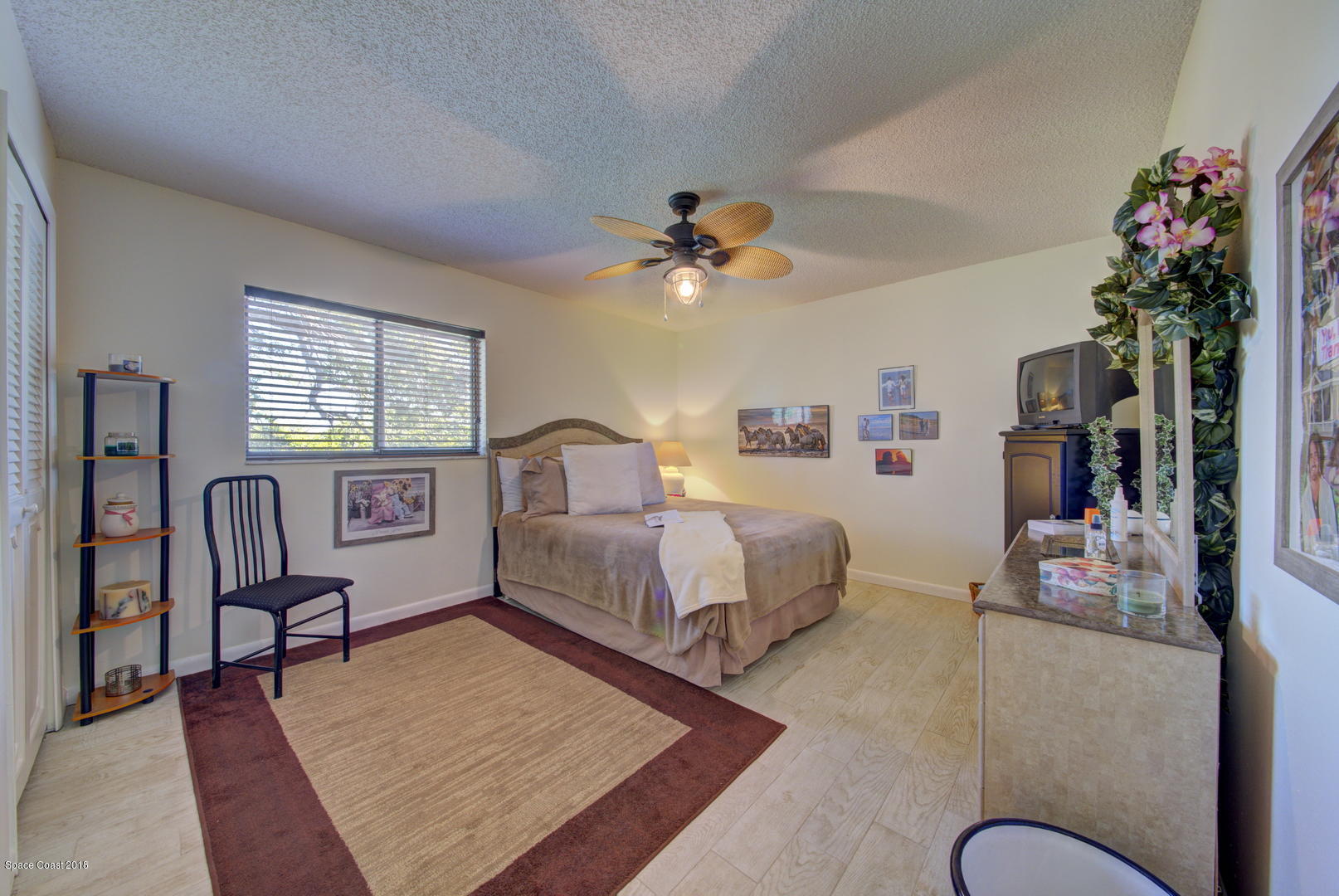 500 Catalina Road, Unit 405 Cocoa Beach, FL 32931 - Photo 4 of 22 Master Bedroom w Wood Look Floor
