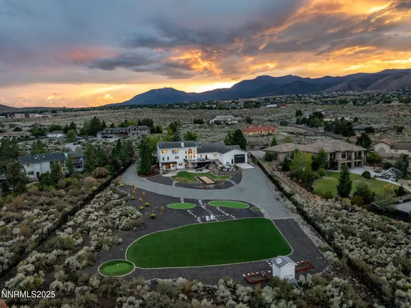 a kitchen with stainless steel appliances granite countertop a kitchen island a stove and a sink