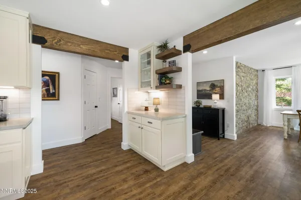 a bedroom with a bed and a mirror
