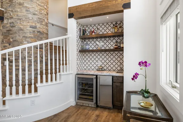 a kitchen with stainless steel appliances kitchen island granite countertop a stove and cabinets