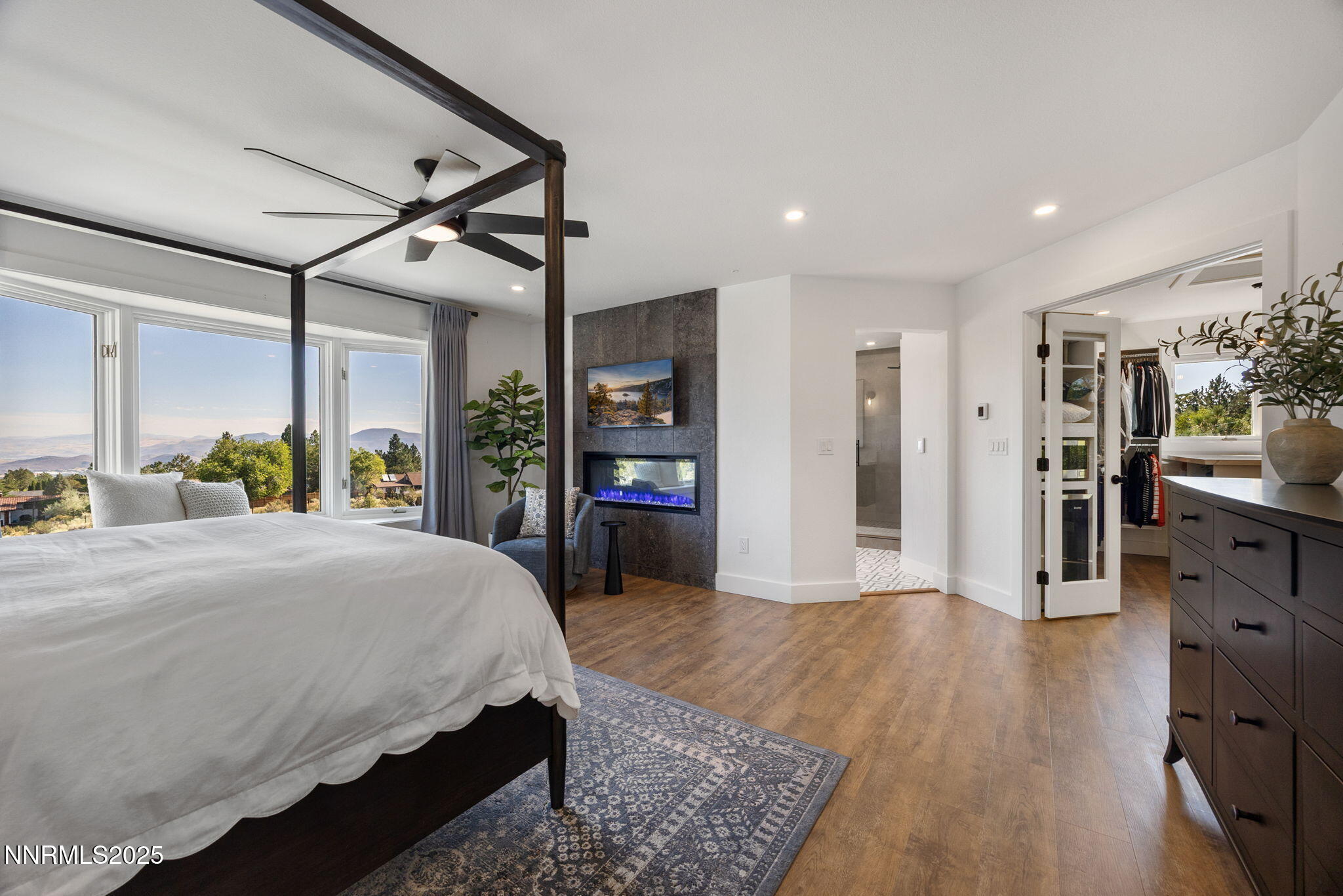 13205 Welcome Way Reno, NV 89511 - Photo 19 of 79 a spacious bedroom with a large bed and a dresser