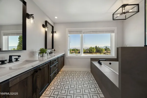 a bathroom with 2 sink and a mirror