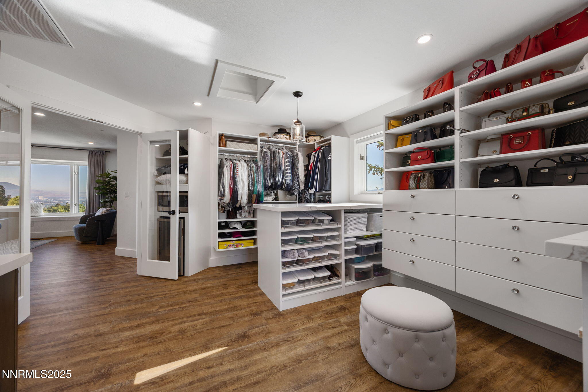 13205 Welcome Way Reno, NV 89511 - Photo 25 of 79 a view of walk in closet with clothes and shoes