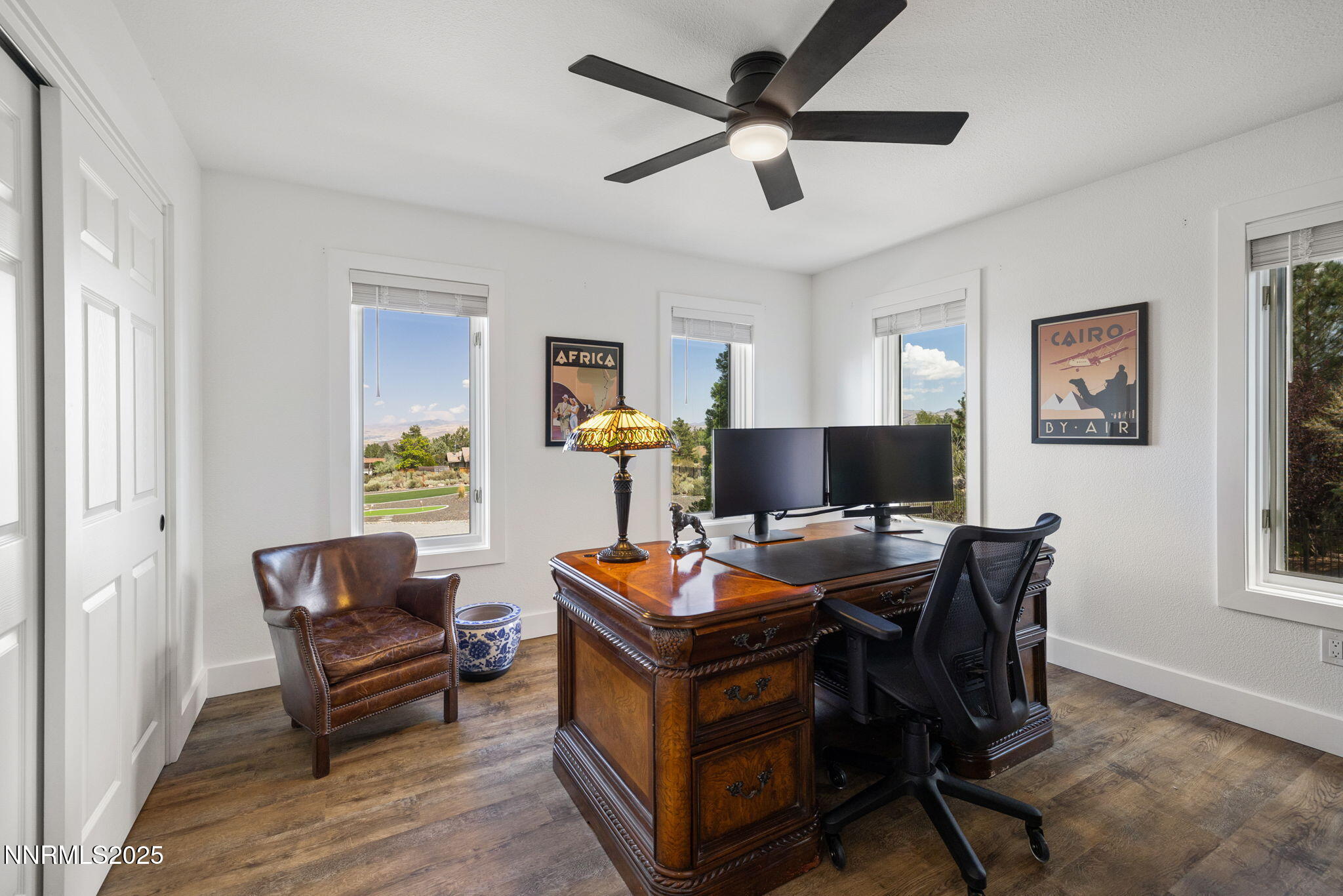 13205 Welcome Way Reno, NV 89511 - Photo 27 of 79 a living room with furniture and a flat screen tv