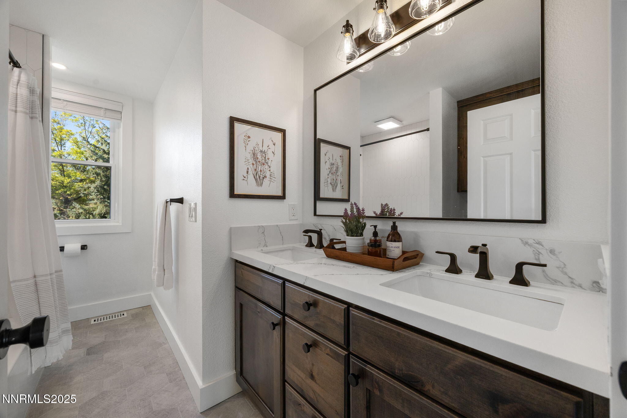 13205 Welcome Way Reno, NV 89511 - Photo 31 of 79 a bathroom with a double vanity sink and a mirror
