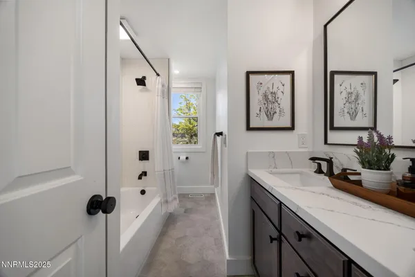 a en suite bathroom with a sink and a mirror