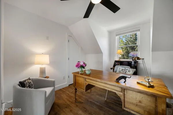 a spacious bedroom with a bed and a dresser