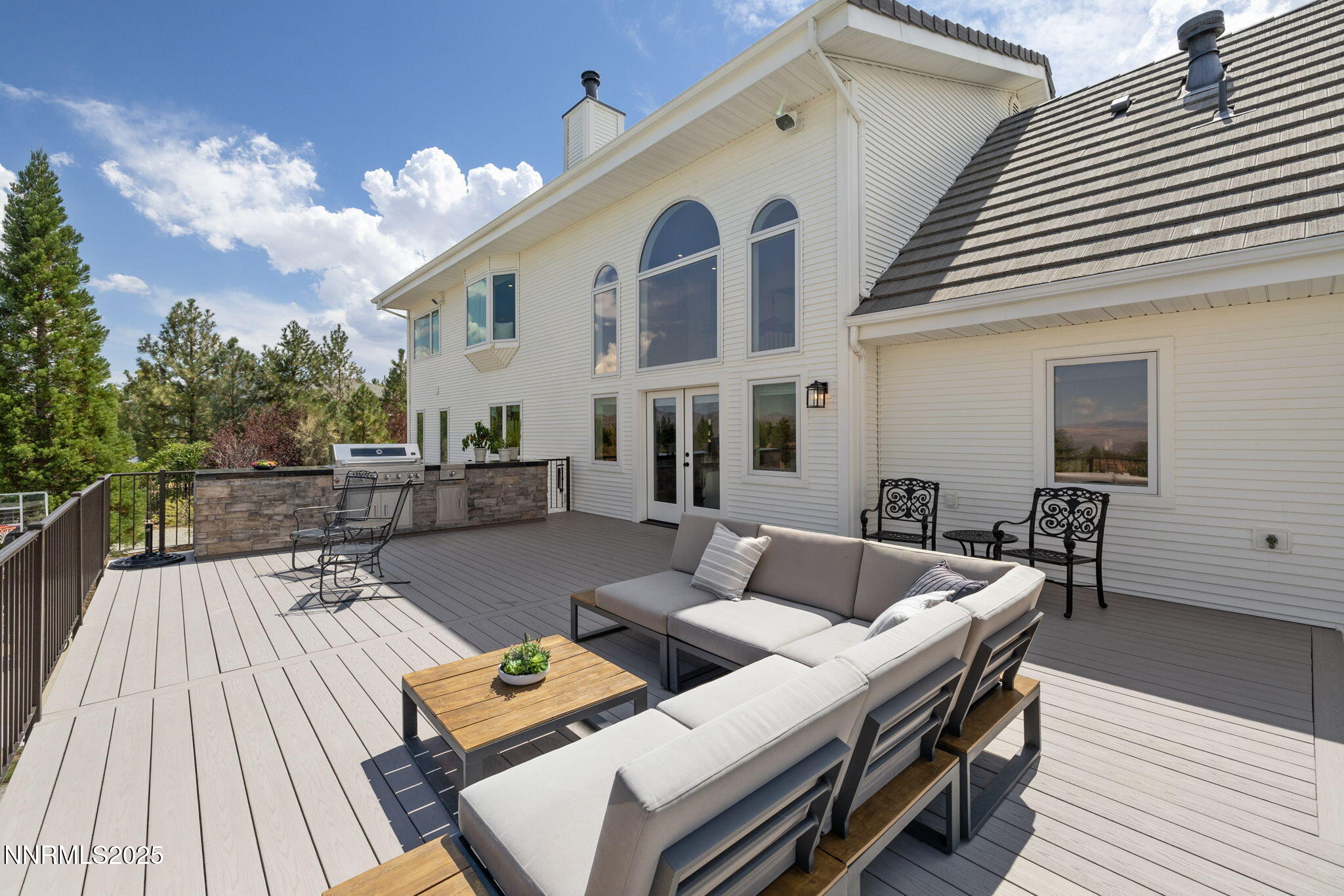 13205 Welcome Way Reno, NV 89511 - Photo 40 of 79 a view of a patio with couches table and chairs with wooden floor