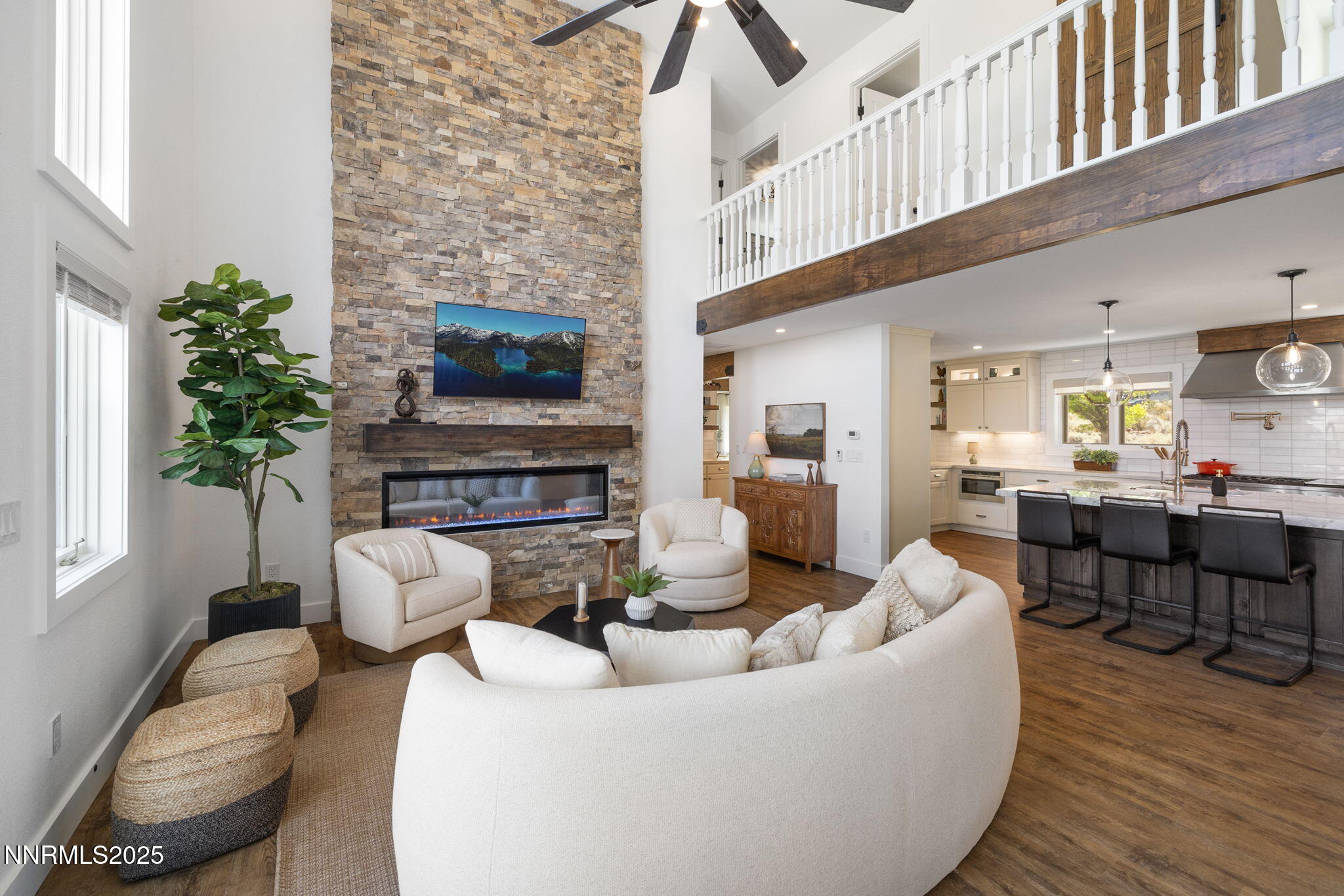 13205 Welcome Way Reno, NV 89511 - Photo 47 of 79 a living room with furniture a fireplace and a flat screen tv