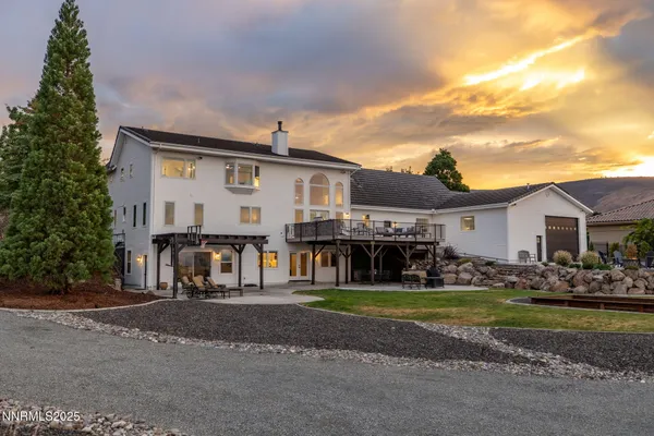 a kitchen with stainless steel appliances granite countertop a sink a stove and a wooden floors