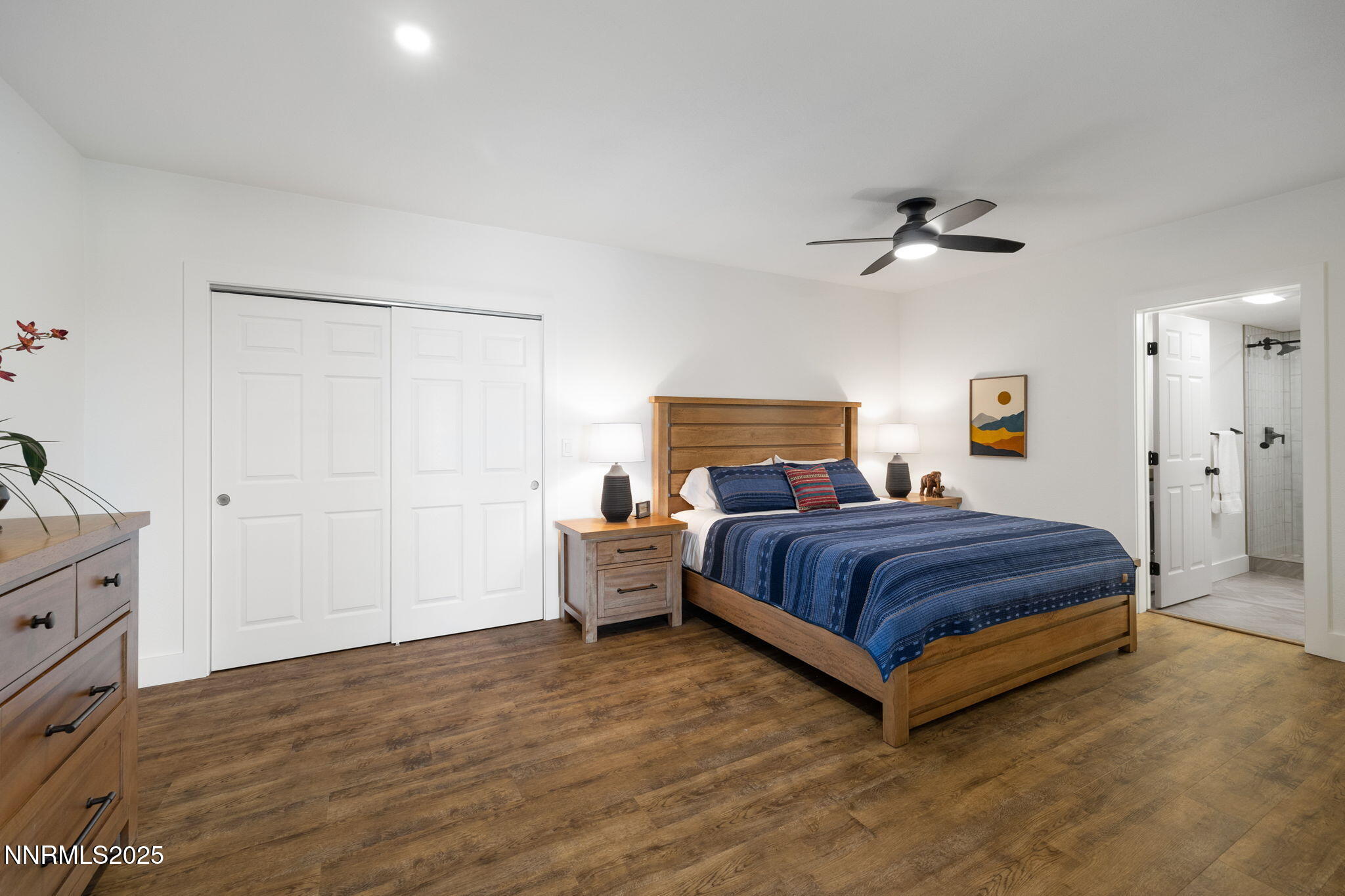 13205 Welcome Way Reno, NV 89511 - Photo 55 of 79 a spacious bedroom with a bed and a dresser