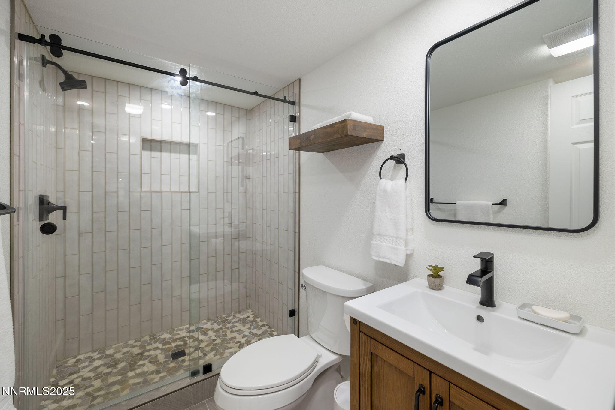 13205 Welcome Way Reno, NV 89511 - Photo 57 of 79 a bathroom with a sink toilet and shower