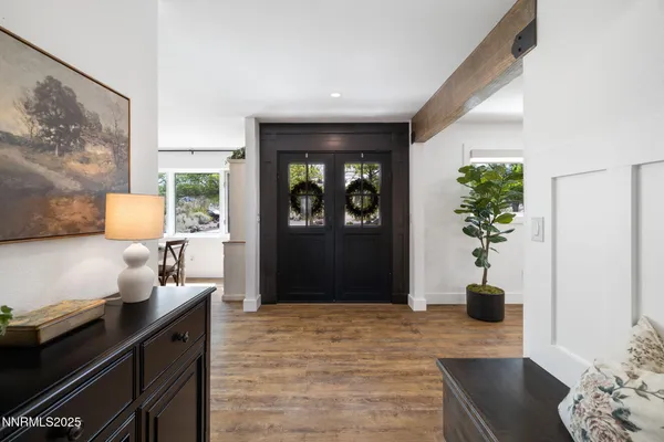 a view of a dining room with furniture window and wooden floor