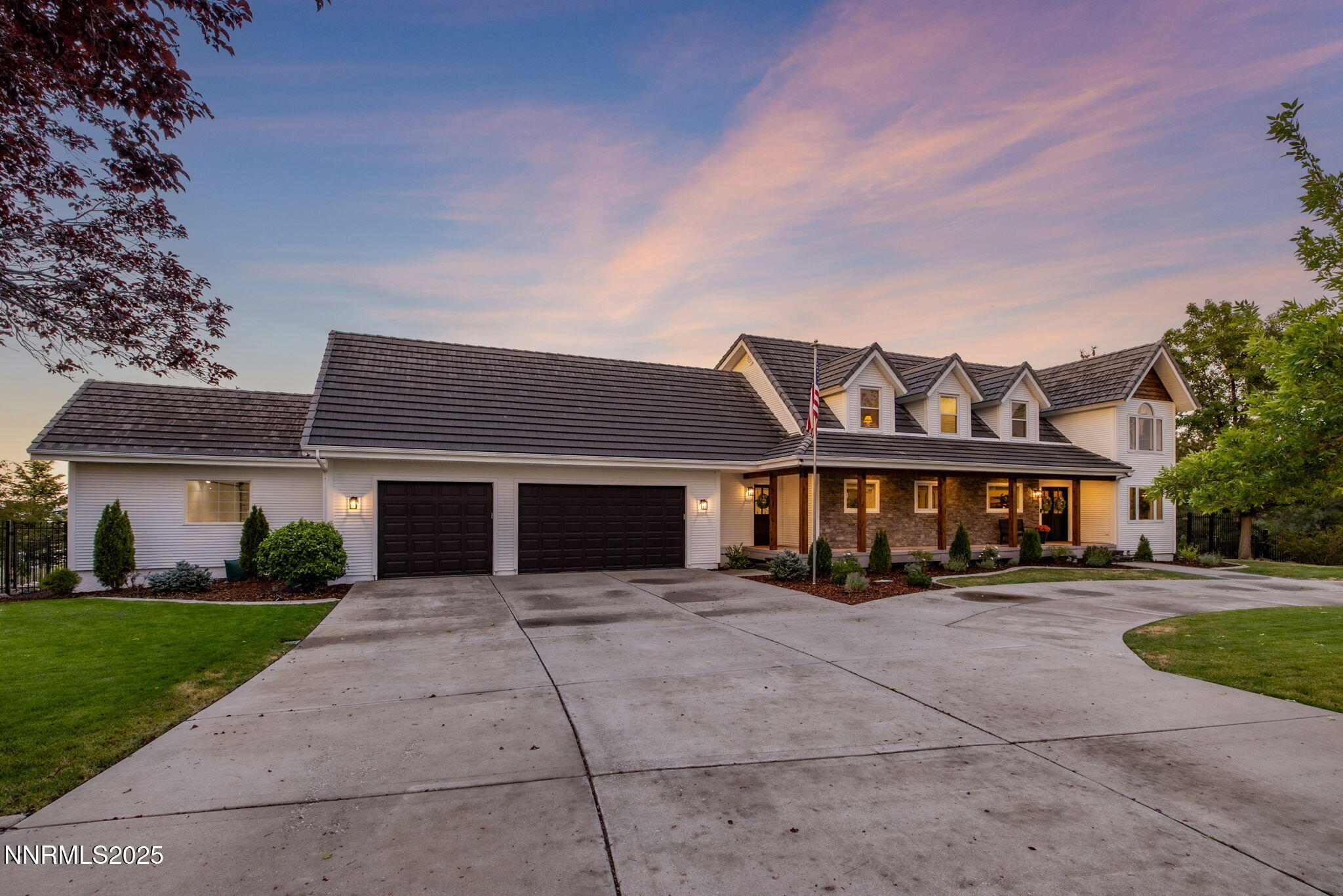 13205 Welcome Way Reno, NV 89511 - Photo 65 of 79 a front view of a house with a yard and trees