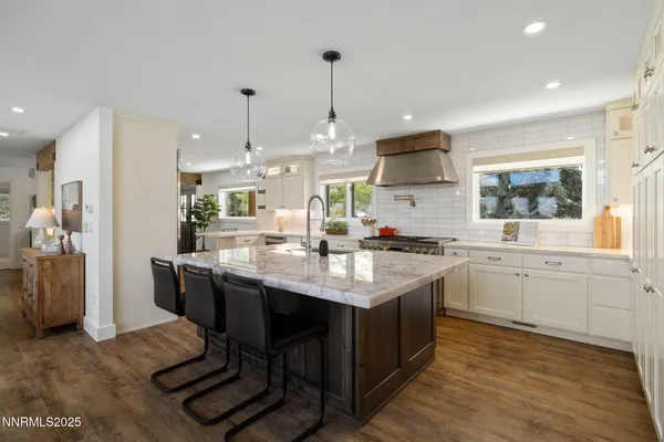 a kitchen with a sink cabinets and window