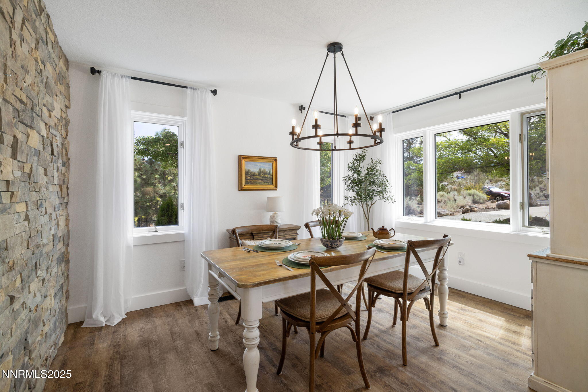 13205 Welcome Way Reno, NV 89511 - Photo 9 of 79 a view of a dining room with furniture window and wooden floor