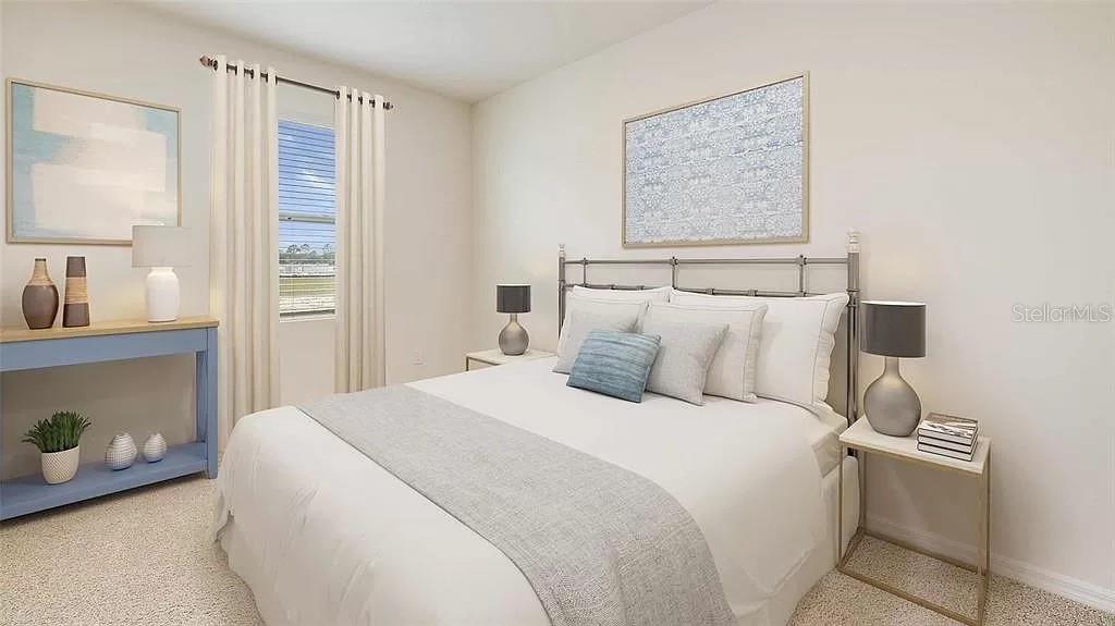 32226 Eldorado Cyn Loop Wesley Chapel, FL 33543 - Photo 13 of 18 a bedroom with a bed and a night stand