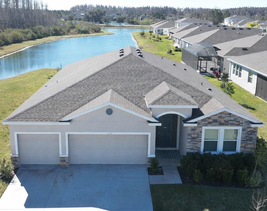32226 Eldorado Cyn Loop Wesley Chapel, FL 33543 - Photo 2 of 18 a house view with a lake view