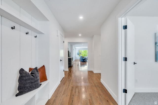 3813 North Foothill Drive Provo, UT 84604 - Photo 7 of 71 Entryway featuring built-in white shiplap bench with storage, black coat hooks, and recessed lighting