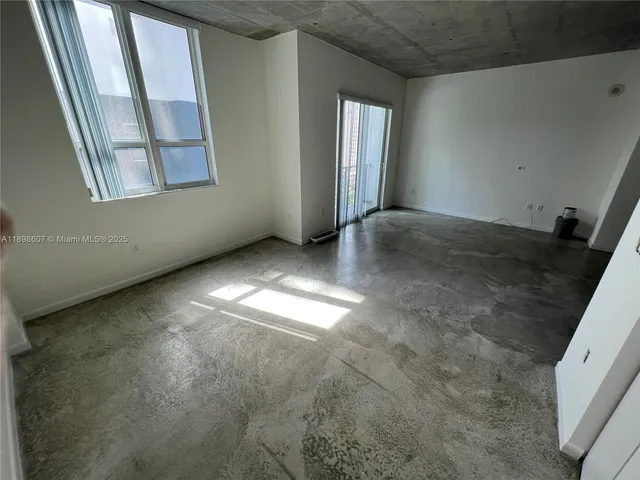 an empty room with windows