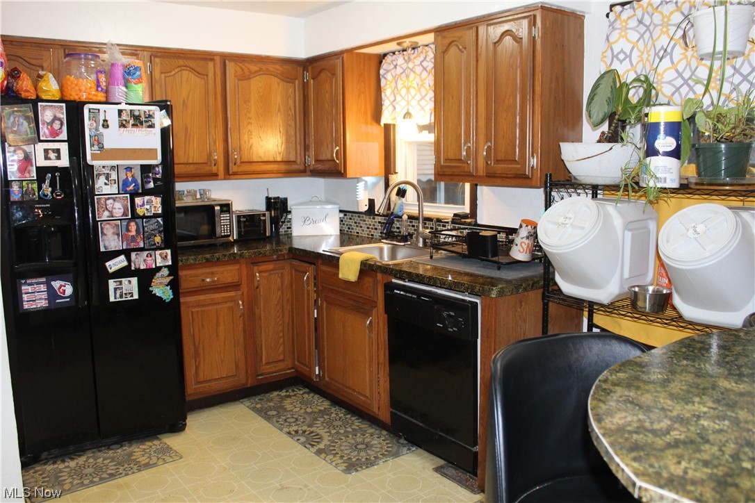 1292 Ford Road Lyndhurst, OH 44124 - Photo 2 of 25 Kitchen featuring sink, and black appliances