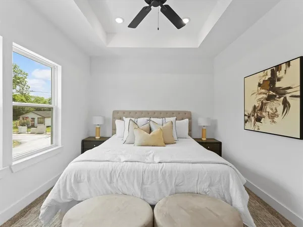 a bedroom with a bed and window