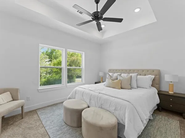 a bedroom with a bed and a couch