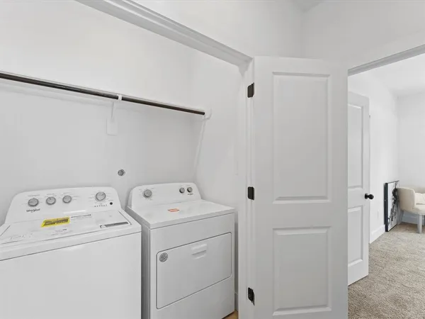 a view of storage and utility room with washer and dryer