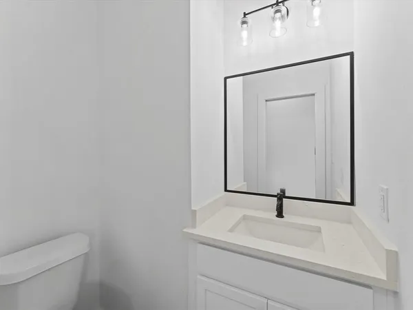 a bathroom with a sink and a toilet