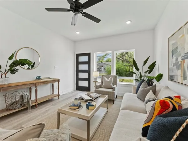 a living room with furniture and a window