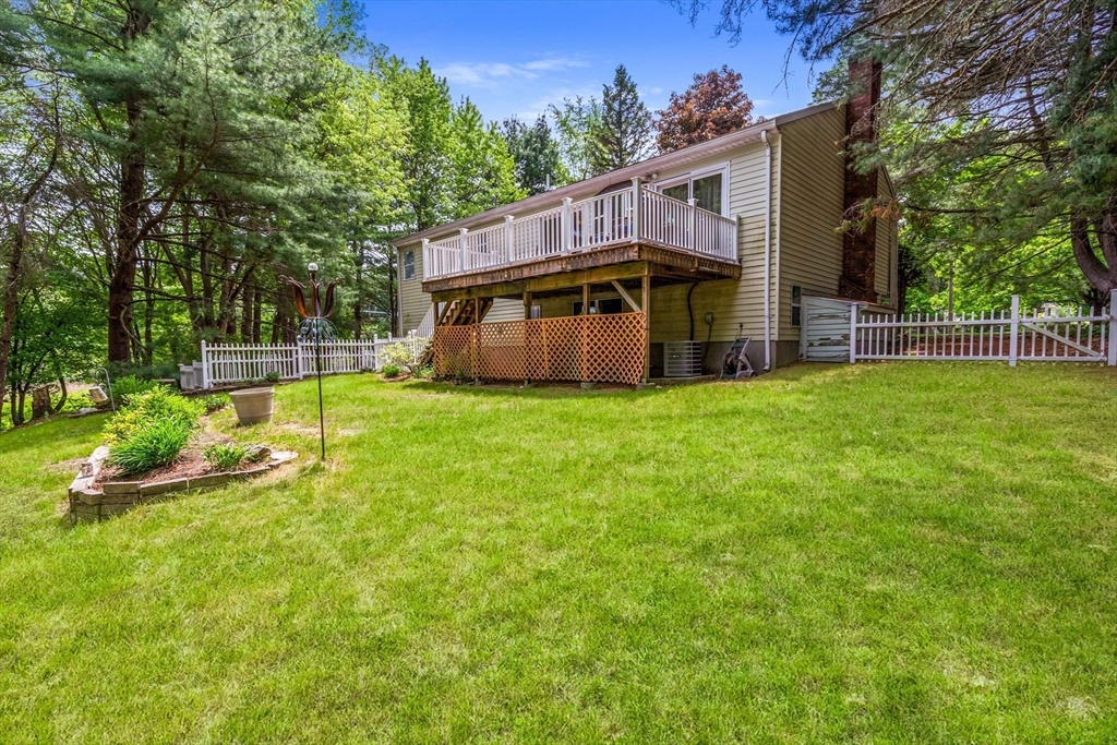 15 Conestoga Road Lexington, MA 02421 - Photo 27 of 31 a view of a house with a big yard and large trees