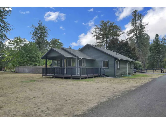 a house with trees in the background