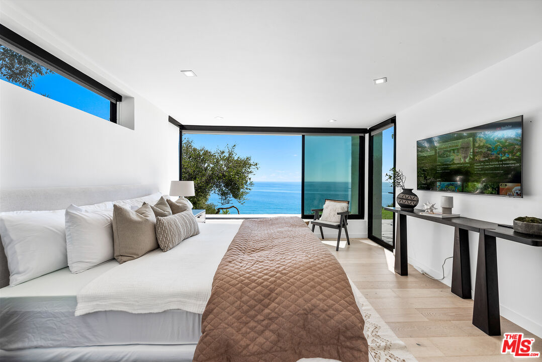 29122 Cliffside Drive Malibu, CA 90265 - Photo 17 of 39 a living room with furniture and a flat screen tv
