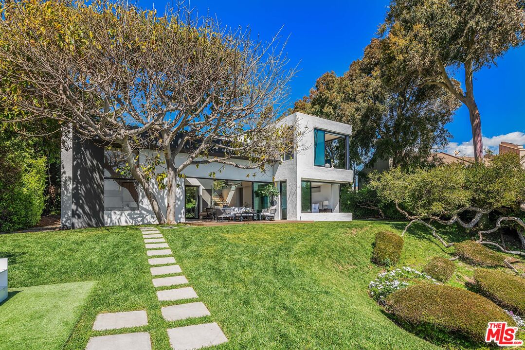 29122 Cliffside Drive Malibu, CA 90265 - Photo 18 of 39 a view of a house with a big yard plants and large trees