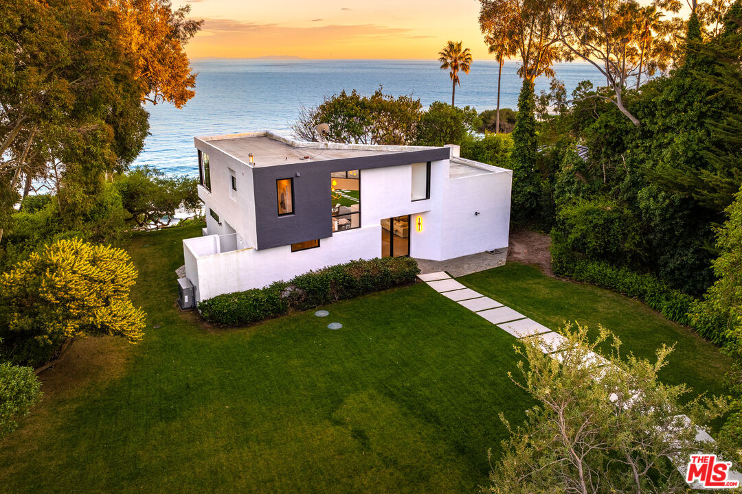 29122 Cliffside Drive Malibu, CA 90265 - Photo 30 of 39 a front view of a house with a yard